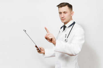 Serious experienced handsome young doctor man isolated on white background. Male doctor in medical uniform, stethoscope holding health card on notepad folder, touch something like click on button.