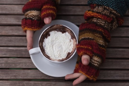 Woman Having Cappuccino At Outdoor Cafe