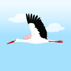 A flying stork with a baby on his back against the sky