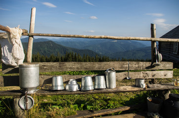 Fototapeta premium Agricultural tools and utensils. Dishes for storage of dairy products.