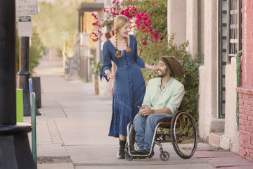 Woman Talking with Man in Wheelchair