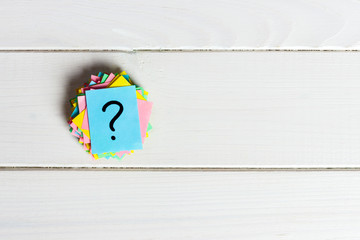 Just a lot of question marks on colored papers