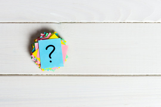 Just a lot of question marks on colored papers