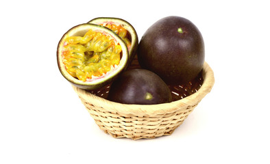 Passion fruit or Passiflora edulis isolated in basket  on white background