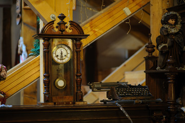 Antiquarian wooden clock with a pendulum