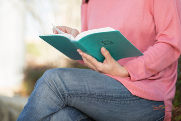 Portrait of a woman reading.