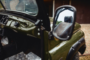 a jeep details with a dark green color with aggressive rubber