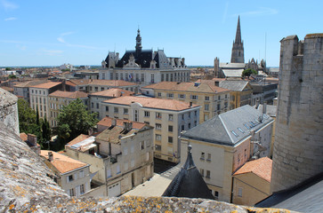 Obraz premium Rooftop view of the historic town of Niort, its Town Hall, and the spire of Notre Dame Church. Niort is a large town in the Deux-Sèvres department in western France.