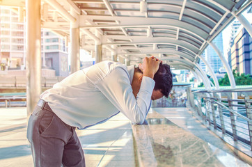 Business man tired or stressed after his work. Image of Stressed businessman concept.