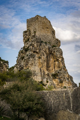 Fototapeta na wymiar Old tower on a stone ciff 