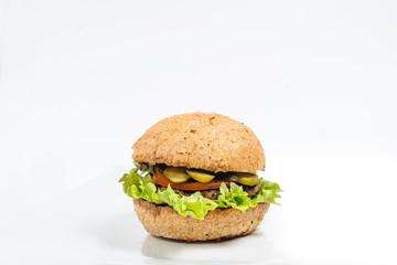 Perfect hamburger/ burger with cheese, bacon, tomato, salad, cucumber