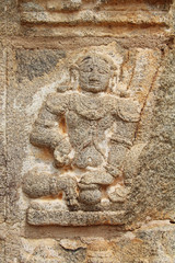 Obraz premium Stone bas-reliefs on the walls the Achyuta Rayas Temple about Courtesan's Street - Sule Bazaar in Hampi, Karnataka, India.