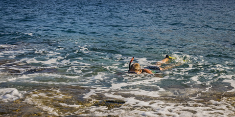 This is a person snorkeling  in the sea 