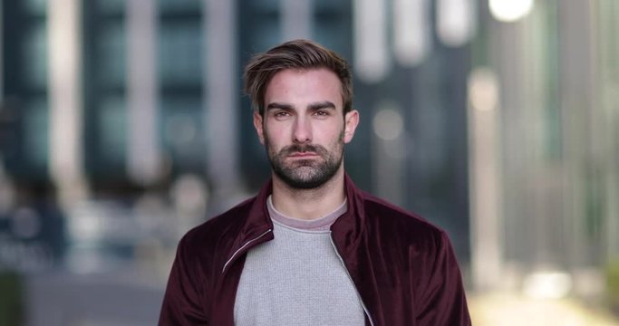 Portrait young adult male in city