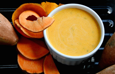 alad cream made from sweet potato steamed and raw potatoes on black tray