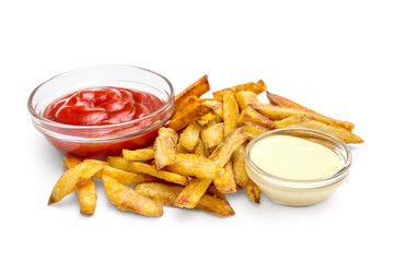 Heap of fried potato with ketchup and mayonnaise on white.