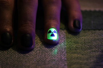 the original manicure in the form of a radioactive danger sign with gel shellac varnish, glows in...