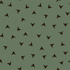 Seamless pattern with black triangles on a green background. Vector.