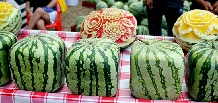 Cubic, square watermelons. Fresh ripe watermelons on display in a sunday market.