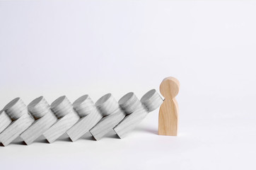 Man stops falling dominoes. Dominoes of people fall on one strong person. The concept of a bold,...