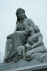 gravestones with stone angels and women tombstones