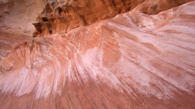 Panning view of sandstone wall in desert canyon in the San Rafael Swell in Utah.