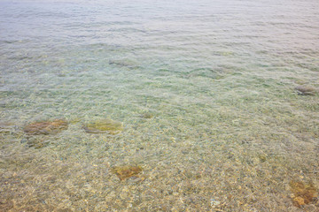 Clear sea surface background. Shallow water, above view