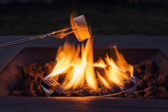Burning Marshmallow On Fire Pit