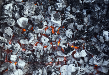 Smoldering ashes coal bonfire closeup fire burn