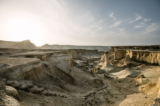sunrise above rugged gorge in the desert, queshm island, iran