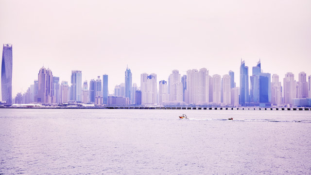 Panoramic picture of Dubai waterfront skyline, color toned picture, United Arab Emirates.