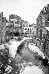 River Running Through Snow Covered Village