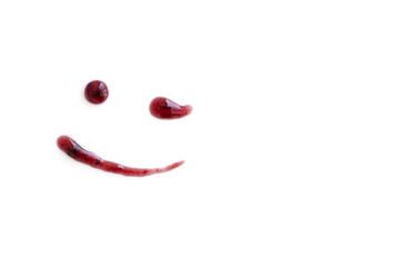 Drawing smile of berry jam, winking