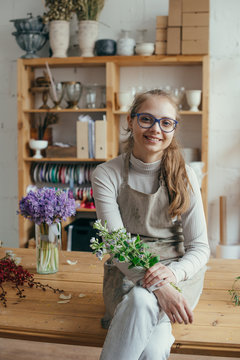 Young florist in flower shop