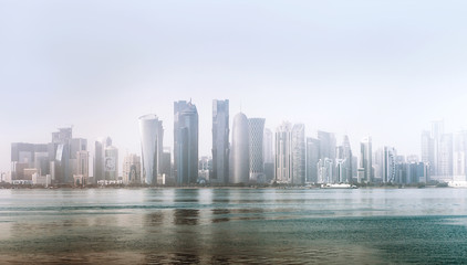Fototapeta na wymiar Doha city, Qatar - December 18, 2017: Al Dafna - seaside district of the Qatari capital Doha located on the Persian Gulf. in Doha, Qatar