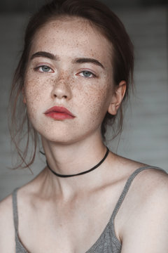 Young girl with freckles close-up