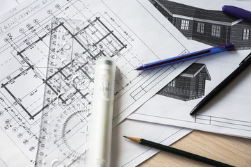 Architect's desktop. Plan of house. Architect workplace. Work with drawings. Office work. Engineer...