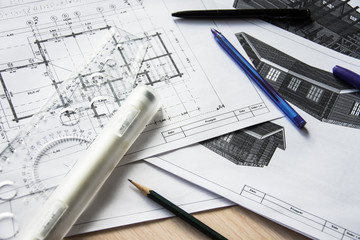 Architect's desktop. Plan of house. Architect workplace. Work with drawings. Office work. Engineer calculates area of the room. Architect's tools.