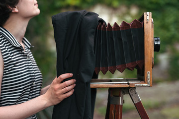 young woman shooting with large format camera