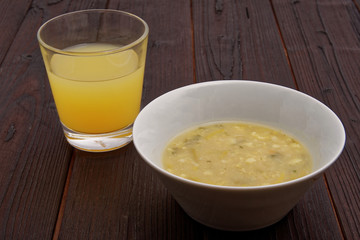 Cauliflower soup with leek on a table