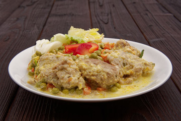 Stewed vegetables with oatmeal dumplings on a table