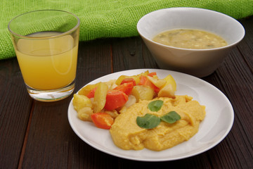 Roasted vegetables and hummus on a table