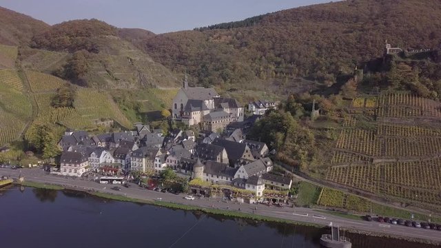 Flight over Beilstein town and autumn vineyards, Mosel valley, Germany. Original untouched LOG format.