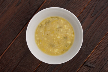 Cauliflower soup with leek on a table