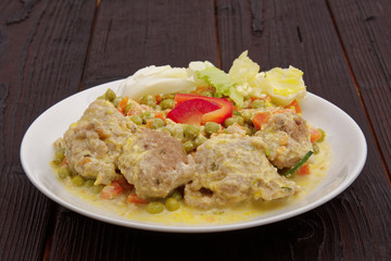 Stewed vegetables with oatmeal dumplings on a table