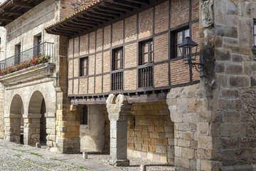 Fototapeta na wymiar Village street, typical houses in touristic village of Santillana del Mar, province Santander, Cantabria, Spain