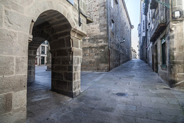 Fototapeta na wymiar Ancient street in historic center of Santiago de Compostela, Galicia, Spain.