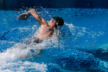 A man beautifully swims