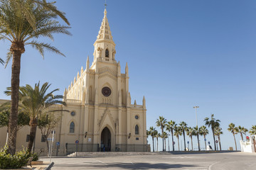 Fototapeta na wymiar Sanctuary of Nuestra Senora de la Regla, maritime promenade of Chipiona, Andalucia.Spain.