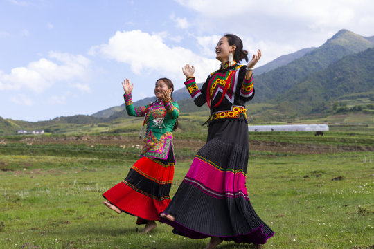 Beautiful Chinese Yi people in traditional costumes  outdoor
